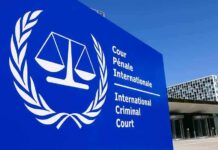 Trump Prepares Sweeping Sanctions Against ICC International Criminal Court sign with scales emblem outside modern building