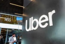 Power Play: Uber Upends NYC’s Plan uber logo on office wall