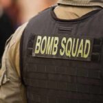 Bomb squad officer wearing tactical vest
