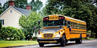 Runaway Bus Smashes Brooklyn Home Yellow school bus driving on a suburban street