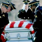 America Honors Six Fallen Heroes Honor guard carrying a flag-draped casket