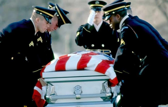 shutterstock_1696761889 Honor guard carrying a flag-draped casket