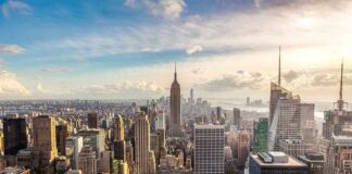 Aerial view of New York City skyline featuring the Empire State Building at sunset