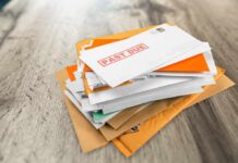 Mailman Caught Red-Handed: You Won’t Believe This Stack of mail with past due notice on top