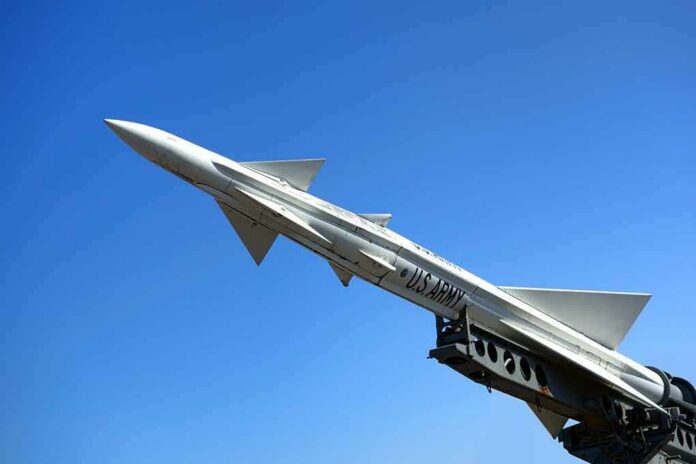 U.S. Army missile on launch rail against clear blue sky