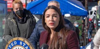 Why AOC Refused The Fox Invitation Woman speaking at outdoor press event with microphones and seal
