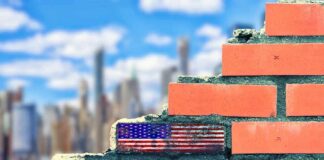 Raw 9/11 Confession Stuns After 25 Years Brick wall with American flag and memorial text against city skyline