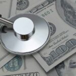 Stethoscope on US dollar bills