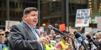 Governor’s GLP‑1 Bonanza Drains Illinois Joey Diaz, Freddie Williams II, and John Sullivan at a podium speaking to a crowd