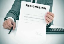 Governor Drops Hammer – Lt. Gov Out Person in suit holding a resignation letter