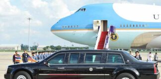 Xi Gets A Rare Washington Welcome Presidential limousine beside a large blue-and-white jet on a runway