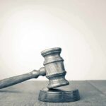 Wooden judge's gavel on sound block