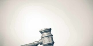 Wooden judge's gavel on sound block