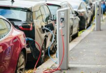 Electric cars charging at curbside stations