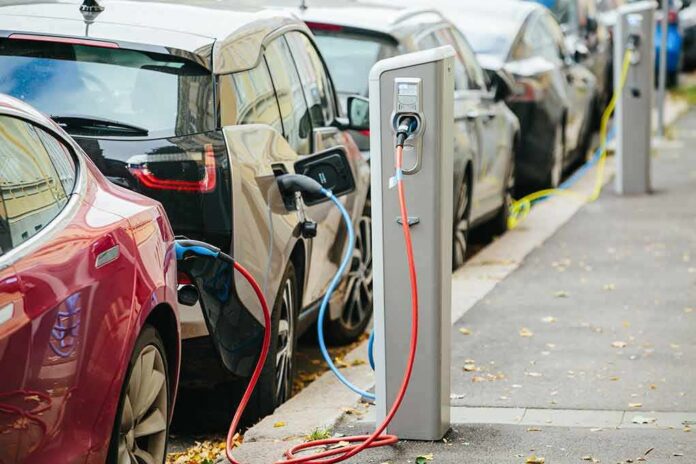Electric cars charging at curbside stations