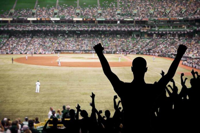 Crowd of fans cheering at a baseball game in a stadium