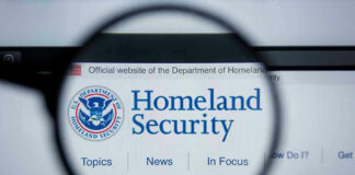 Election Panic: DHS Halted Nationwide Magnifying glass showing Homeland Security website.