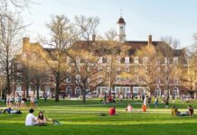 Deadly “Coke” Lie Sparks Rape Charge Students relaxing on a campus quad in front of a brick academic building