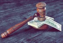 LA County Collects Tax It Cannot Spend Judge's gavel resting on a stack of US dollar bills