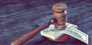 LA County Collects Tax It Cannot Spend Judge's gavel resting on a stack of US dollar bills