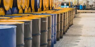 Defense Act Targets Fuel Shortage Rows of industrial metal barrels with yellow lids