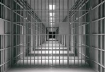 Death Row On Purpose? empty prison corridor with barred cells