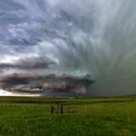 Hybrid Monster Targets I‑35 supercell thunderstorm over green prairie landscape