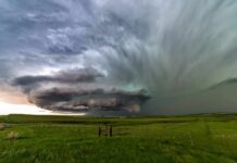 Hybrid Monster Targets I‑35 supercell thunderstorm over green prairie landscape