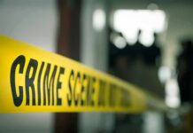 Pregnant Mom Torched – Child Watches crime scene tape in a blurred indoor setting