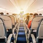 Cockpit Attack Triggers Death-Defying Dive airplane cabin with passengers seated in economy class