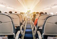 Cockpit Attack Triggers Death-Defying Dive airplane cabin with passengers seated in economy class