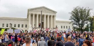 Kid Rock Makes A Bold Claim About America David Givens at a large protest outside a neoclassical courthouse