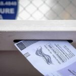 X Marks Trouble In Detroit Ballots Mail-in ballot being inserted into a secure drop box slot