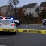 Workplace Threat Explodes Into Gunfire Sheriff's vehicles behind yellow do-not-cross tape