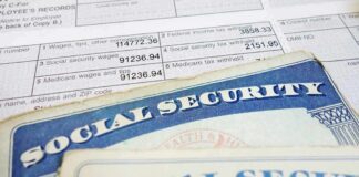 Social Security cards on top of a tax form