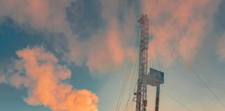 Central Asia Deal Teases Price Relief Oil drilling rig at sunset releasing steam