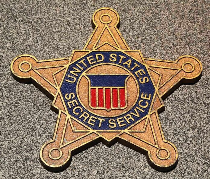 shutterstock_134990735 Golden badge of the United States Secret Service displayed on a surface