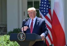 Diesel Tax Holiday Shocks Highways Donald Trump speaking at a podium with U.S. and Polish flags behind him