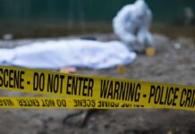 Missing Maryland Dad Found Dead Crime scene with police tape and forensic investigator