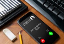 Trump’s Bounty On Fraudsters smartphone on desk showing an incoming anonymous call