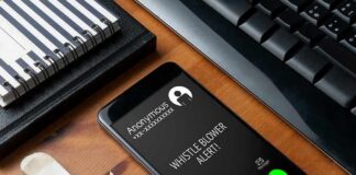smartphone on desk showing an incoming anonymous call
