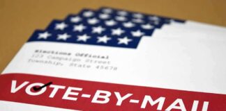 Mail-in ballot envelope with red vote-by-mail banner