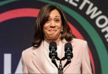 Locked Doors At Harris Stop – Press Frozen Out woman at podium with two microphones