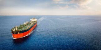 Hormuz Is Open — But Who Controls It? Oil tanker sailing on calm open sea