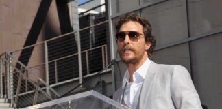 Matthew McConaughey speaking at a podium outdoors