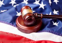 Senator Files Bar Complaint Over Subpoenas Judge’s gavel on a wooden block over the American flag