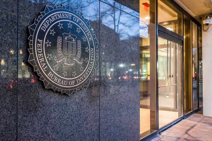 shutterstock_555190222 FBI emblem on a stone wall beside a glass entrance