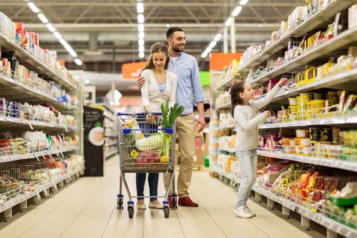 shutterstock_562295758 Family shopping in a grocery store aisle