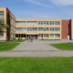 School building with three stories and wide windows