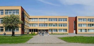 School building with three stories and wide windows